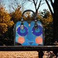 Blue Abstract Face Shoulder Handbag | Whimsical Floral Eyes, Orange Cheeks
